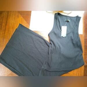 New size small woman’s black midi dress with open back